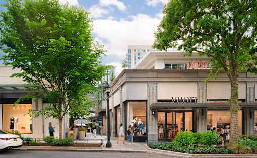 A street view of a shopping area with a Burberry store.