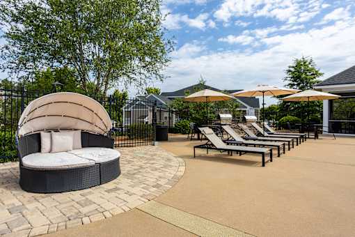 A sun lounger area with a circular sunbed in the middle.