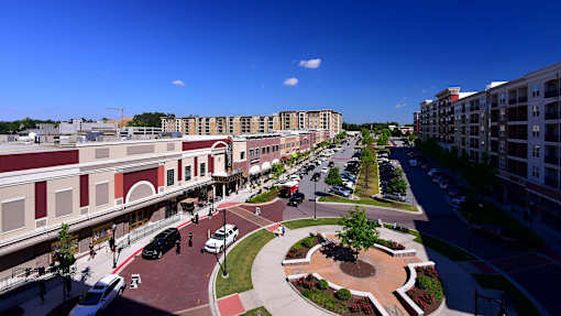 Luxury Apartments in Atlanta, GA with In-Unit Washer and Dryer - 1105 Town Brookhaven - City Street with Ample Parking Spaces and Cars Along Both Sides of the Road.