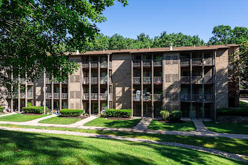 A large apartment complex with a green lawn in front at Winchell Way Apartment , Kalamazoo, 49008