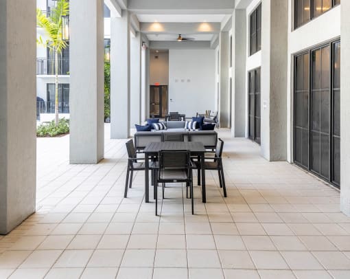 a patio with a large table and chairs at Leena Plantation, Plantation, FL