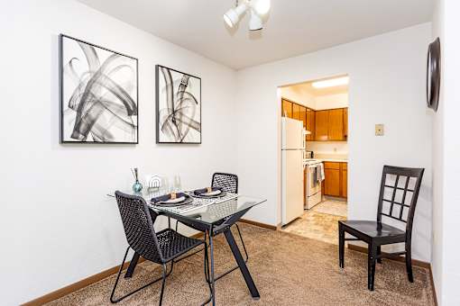 A dining room with a glass table and chairs at Winchell Way Apartment , Kalamazoo, 49008