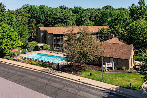 A house with a pool in front of it at Winchell Way Apartment , Kalamazoo, 49008
