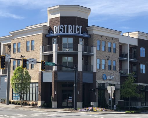 a building with a sign on top of it on a city street