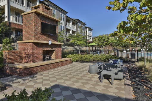 the preserve at ballantyne commons courtyard with fireplace and patio furniture