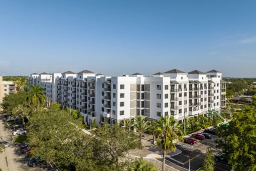 an aerial view of a large apartment complex with trees and a parking lot at Leena Plantation, Plantation, FL