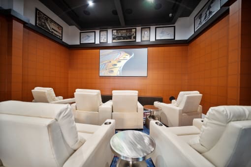 a meeting room with white chairs and a table at Altis Grand Central, Florida