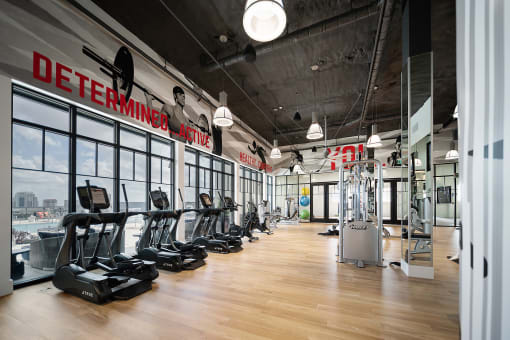 a large fitness room with treadmills and other exercise equipment at Altis Grand Central, Tampa, 33606