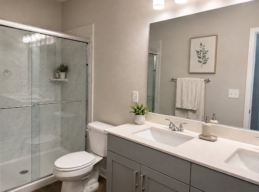 Bathroom with walk in shower and vanity lighting