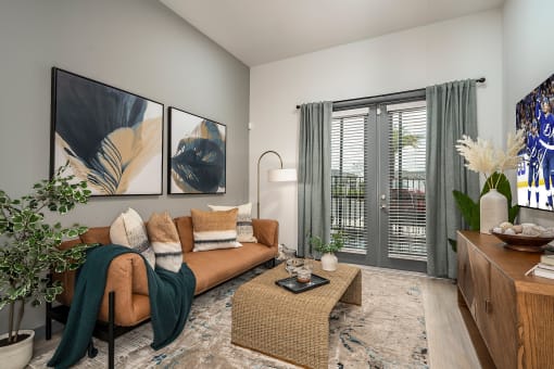 an open living room with a couch and a coffee table
