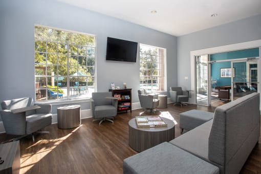a living room filled with furniture and a flat screen tv