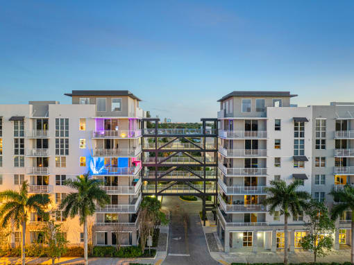 an overhead view of an apartment complex with a bridge