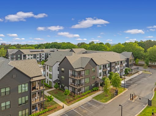 an aerial view of an apartment building on a city street