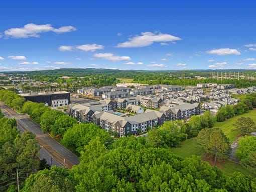 an aerial view of a city with houses and trees