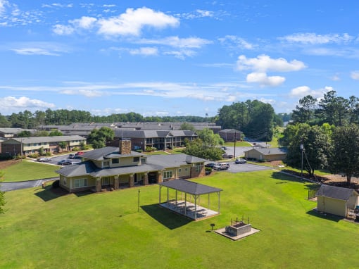 an aerial view of a neighborhood with houses and a field