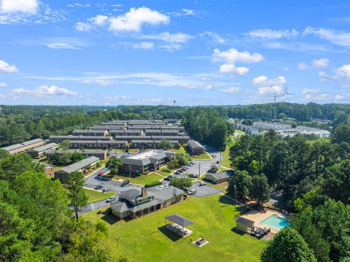 an aerial view of a campus with trees and buildings