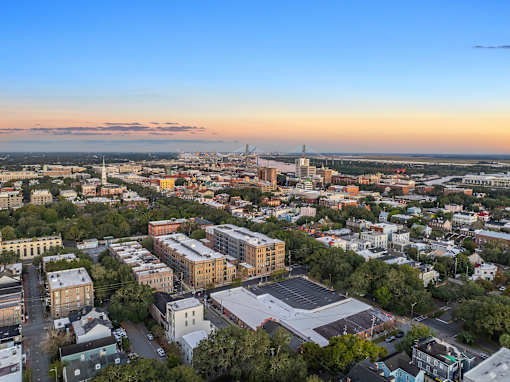 an aerial view of the city at sunset