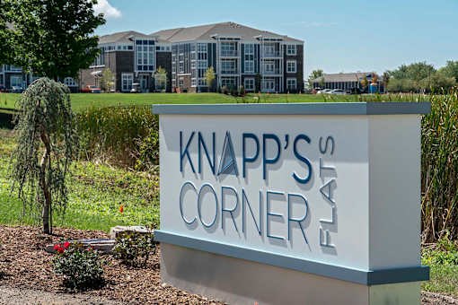 Knapp's Corner sign in front of a building.
