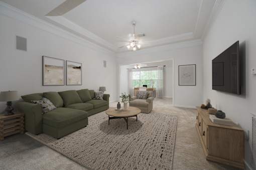 A living room with a green couch and a coffee table.