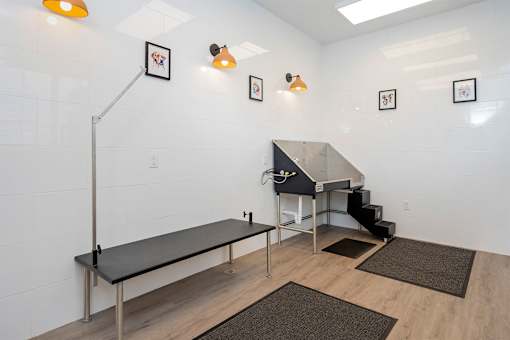 A room with a staircase and a table.