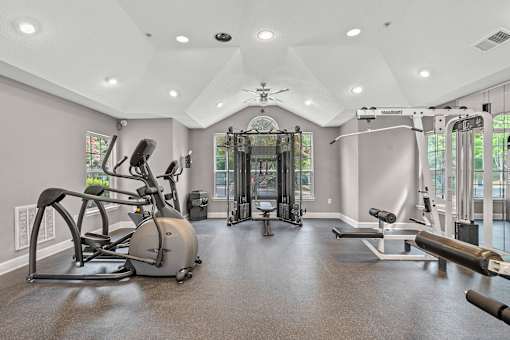 A spacious home gym with a variety of exercise equipment.