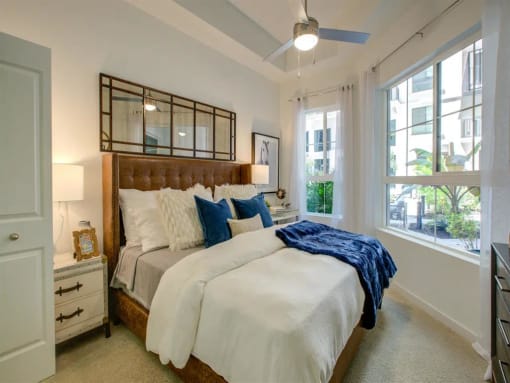 a bedroom with a bed and a window at Altis Grand Central, Tampa Florida