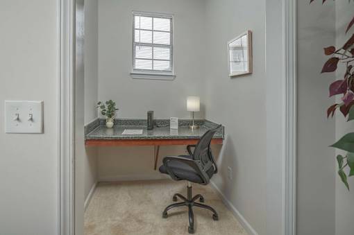 A small office with a desk and chair.