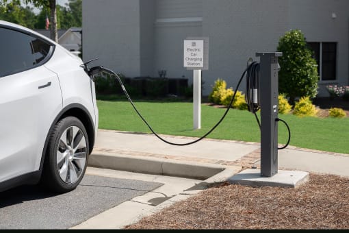 a car is plugged in to an electric charger