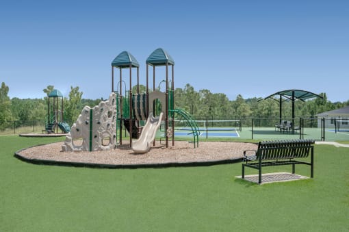 a playground with a play set and a bench