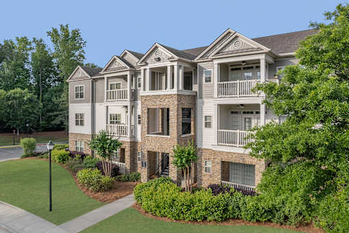 A large, well-maintained apartment complex with multiple buildings and greenery.
