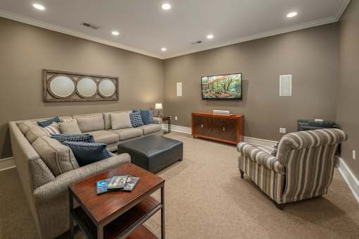 A living room with a couch, chair, and coffee table.