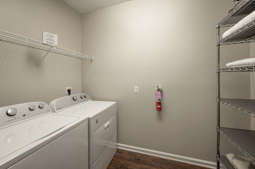A laundry room with a washer and dryer.