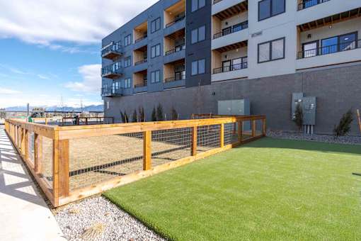 A large grassy area in front of a building.