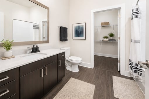 A bathroom with a white toilet and a white sink.