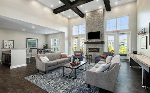 A living room with a grey couch and a coffee table.