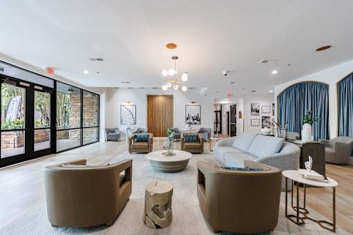 A living room with a white ceiling and a large window.