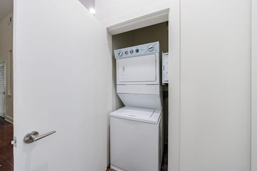 A white oven and dishwasher in a small kitchen.