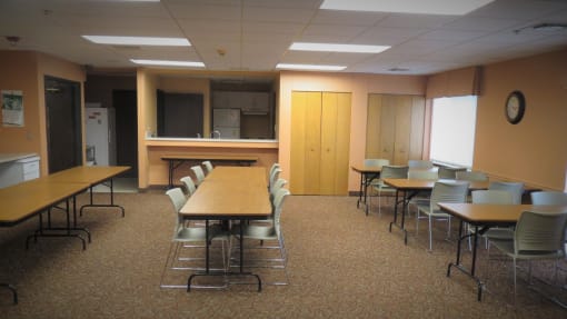 a large room with tables and chairs