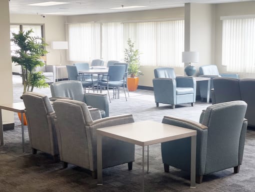 a room filled with furniture and a large window