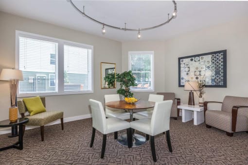 a dining room with a table and chairs