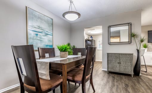 the dining room of a home with a table and chairs at L'Estancia, Sarasota, FL