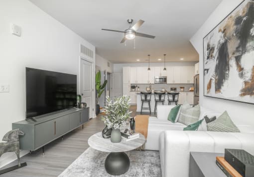 an open living room with a couch and a tv