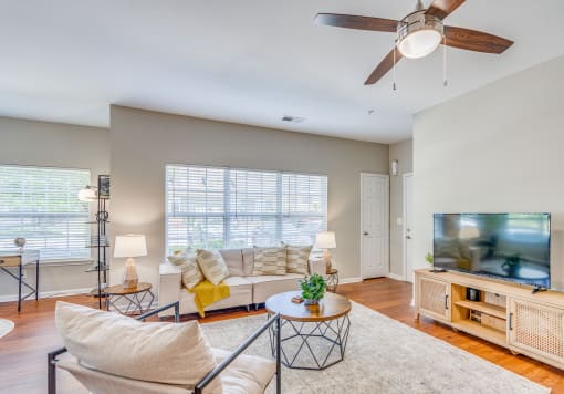 a living room with a couch and a tv
