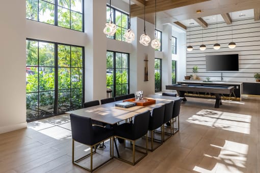 a dining room with a ping pong table and a foosball table  at Leena Plantation, Florida