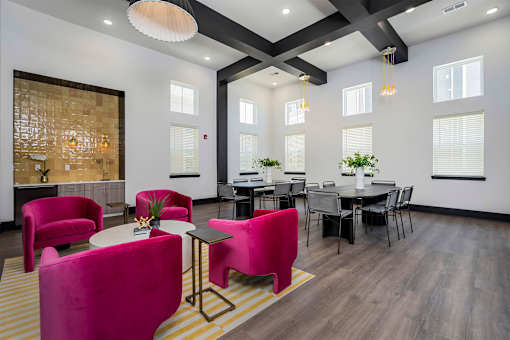 A modern dining room with a glass wall and a wooden floor.