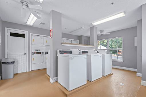 A laundry room with a washer and dryer in it.