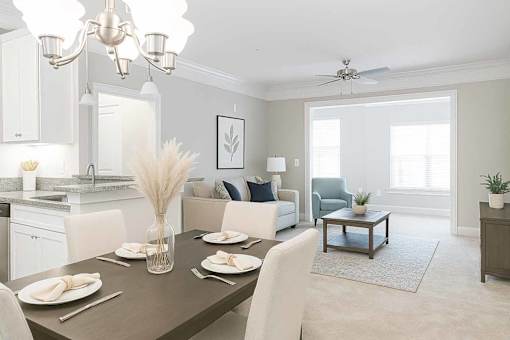 A dining room with a table set for a meal.