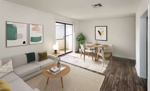 A living room with a white couch, a wooden coffee table, and a dining table with chairs.