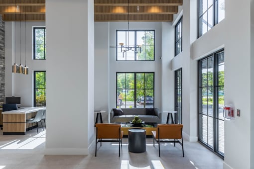a large living room with high ceilings and large windows at Leena Plantation, Plantation, 33322