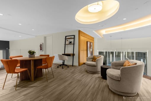 a living room with couches and chairs and a round table